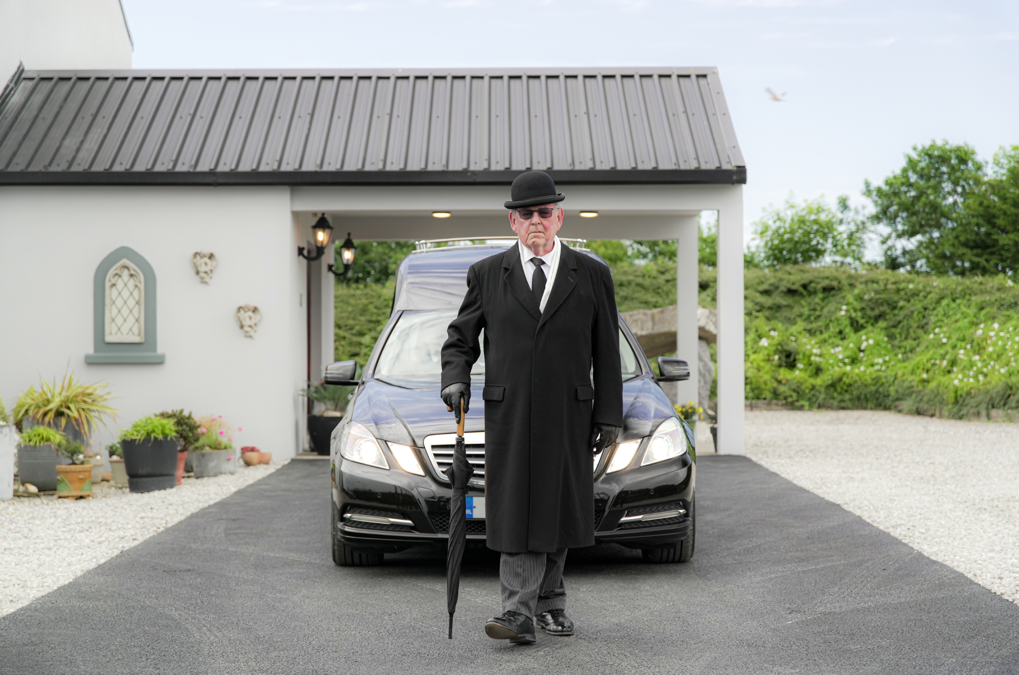 James Falconer walking in front of hearse in Tramore